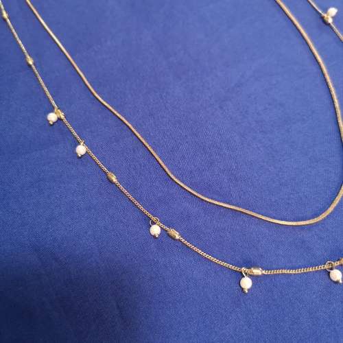 Layered strand chain necklace with hanging pearl detail