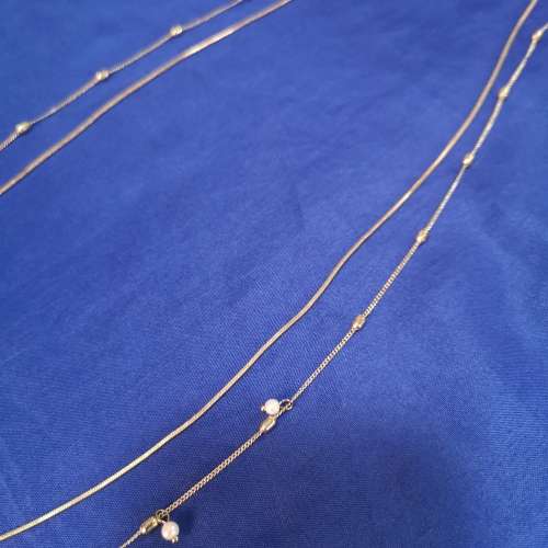 Layered strand chain necklace with hanging pearl detail