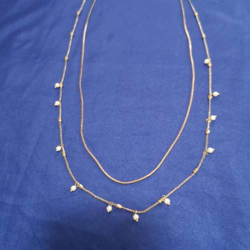Layered strand chain necklace with hanging pearl detail
