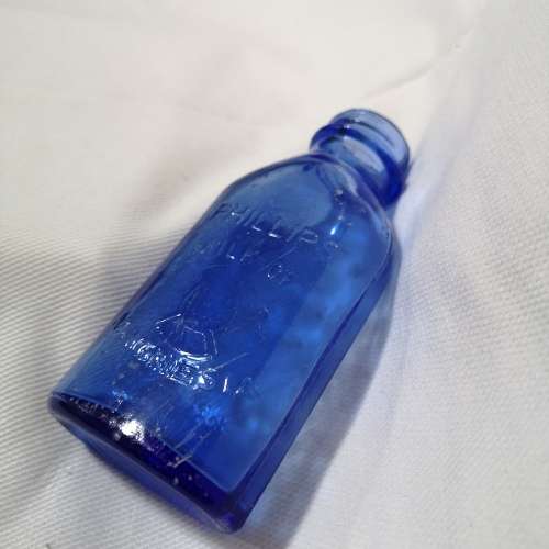 Vintage cobalt blue Philips milk of magnesia bottle. Chemist Bottle