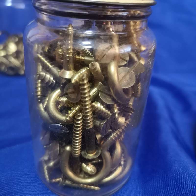 Vintage bottles with vintage brass hardware items. Ideal as garage decor or useable items