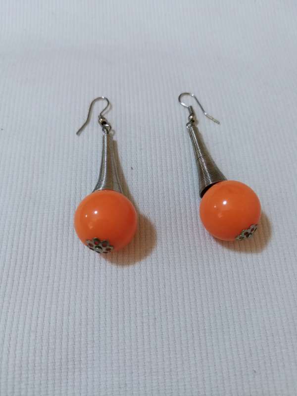Eye catching, arty hanging orange bead earrings