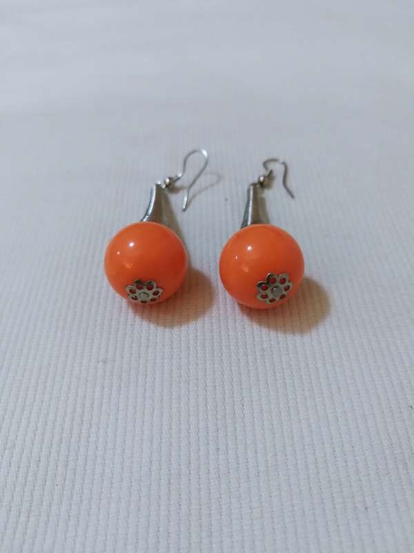 Eye catching, arty hanging orange bead earrings