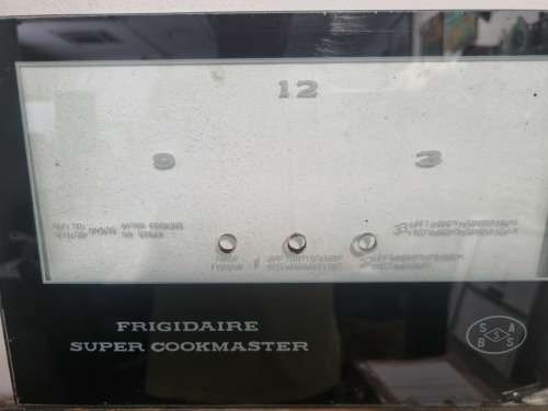 FRIGIDAIRE SUPER COOKER STOVE TIMER AND CLOCK GLASS FRONT.  290MM X 192MM.