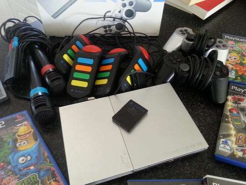 Playstation 2 (silver, streamline) with 15 games