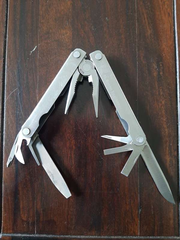 Leatherman LM832518 Heritage PST Multi-tool number 0298 with leather and synthetic pouch, like new