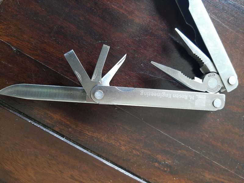 Leatherman LM832518 Heritage PST Multi-tool number 0298 with leather and synthetic pouch, like new