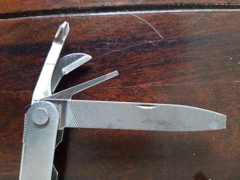 Leatherman LM832518 Heritage PST Multi-tool number 0298 with leather and synthetic pouch, like new