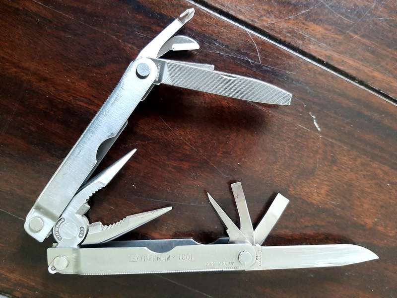 Leatherman LM832518 Heritage PST Multi-tool number 0298 with leather and synthetic pouch, like new