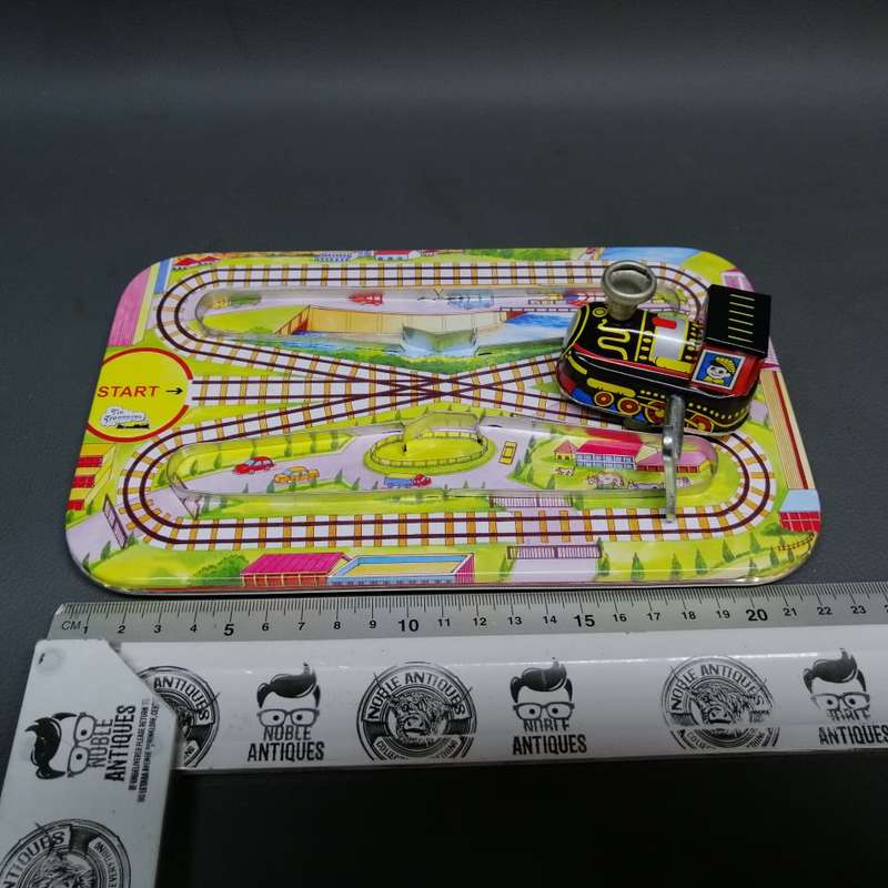 Highly Collectible Lithographed Wind Up Tin Toy Train and Track!!!