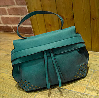 Tassels and rivets fashion ladies handbag with strape. Green color. Stock in ZA