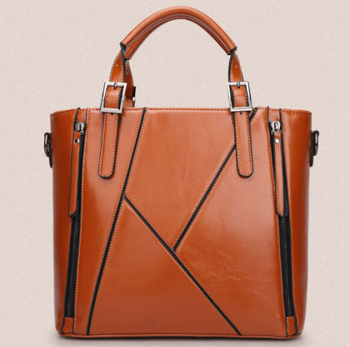 Elegant and beautiful ladies handbag with strape. Brown color.