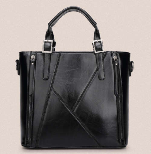 Elegant and beautiful ladies handbag with strape. Black color.