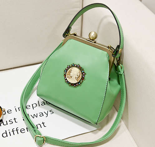 Vintage England style lesure handbag, with strape. Green color.