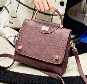 Fashion hard leather ladies leisure handbag, with strap. Purple red. Stock in ZA