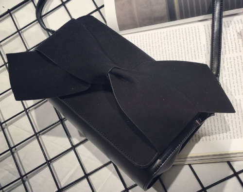 Nubuck bowknot clutch. Black color.