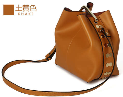 Genuine leather rivet bucket bag. Brown color.