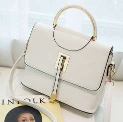 Modern stylisg handbag. White color. Stock in ZA.