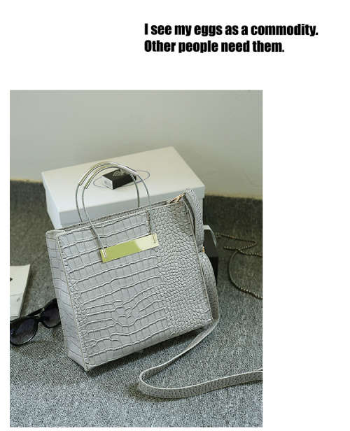 Crocodile pattern stereotyped fashion steel handle handbag. Grey color.