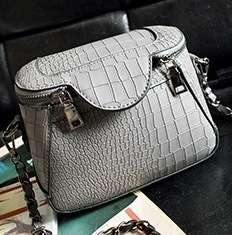 Crocodile embossed strong leather bucket handbag. Grey color.