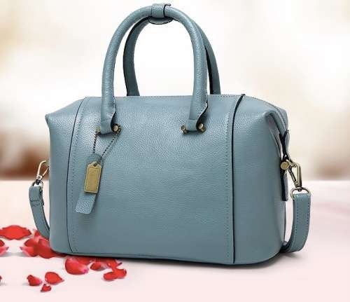 Fashion barrel style ladies handbag. Blue color. Stock in ZA
