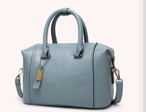 Fashion barrel style ladies handbag. Blue color. Stock in ZA