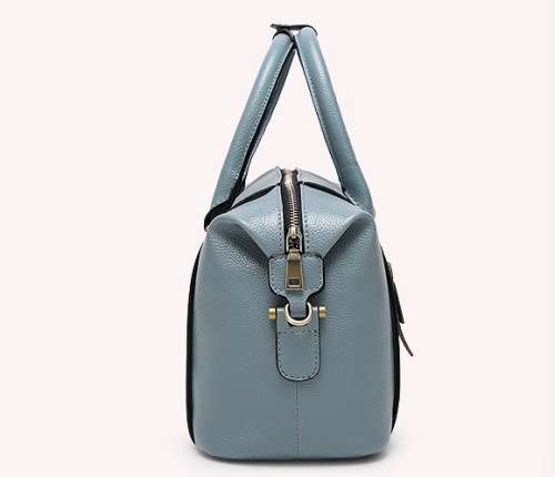 Fashion barrel style ladies handbag. Blue color. Stock in ZA