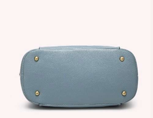 Fashion barrel style ladies handbag. Blue color. Stock in ZA