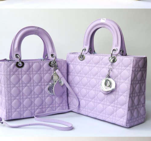 Genuine leather Princess Diana favour handbag. color purple. With belt. Stock in ZA
