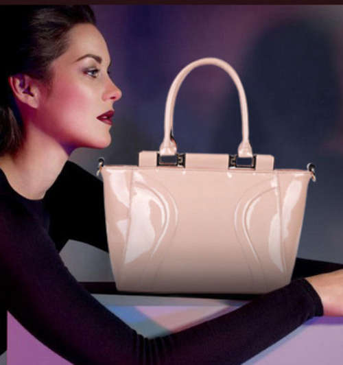 Genuine leather designed handbag. cream color. Stock in ZA