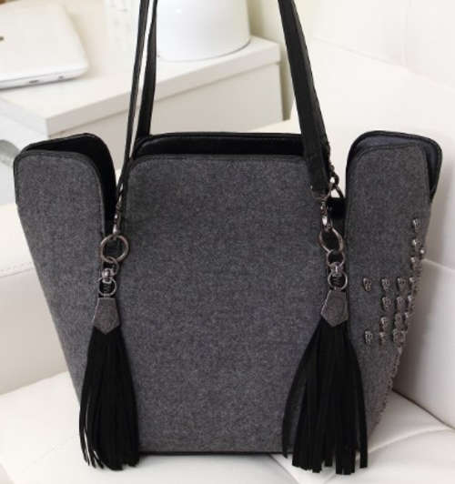 Fashion rivets woolen surface shoulderbag. Grey color. Stock in ZA