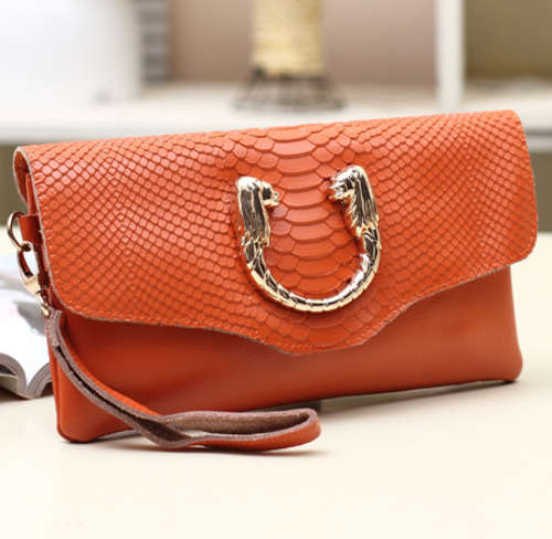 The second layer genuine cow leather clutches. Orange color.