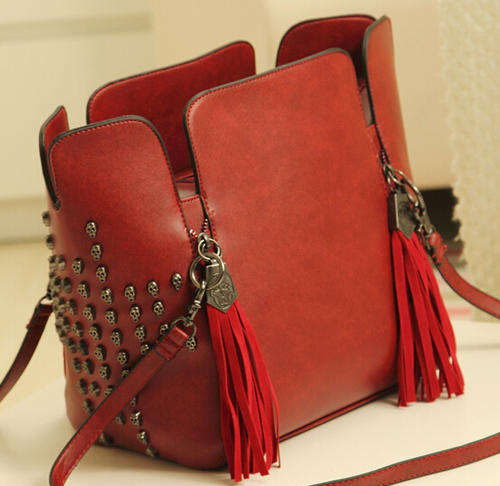 Punk style skull rivets large capacity handbag. Maroon color.
