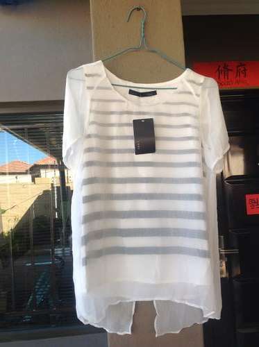 Clearance price, ladies spots top. Size 32