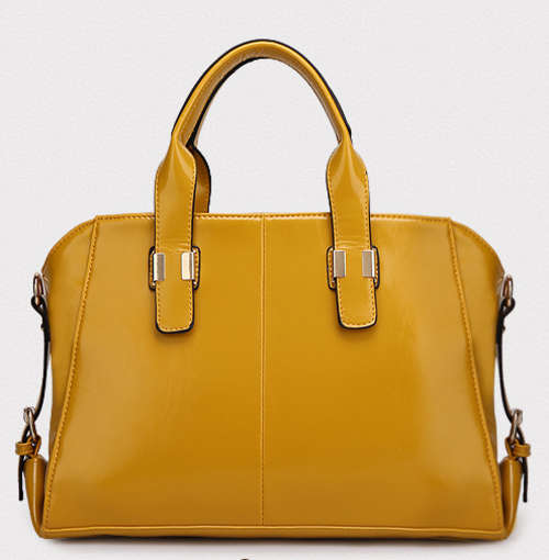 Noble style ladies large handbag with strape. Yellow color. Stock in ZA