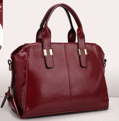 Noble style ladies large handbag with strape. Maroon color. Stock in ZA
