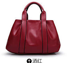 Simply design large capacity ladies handbag with stretch. maroon color. Stock in ZA