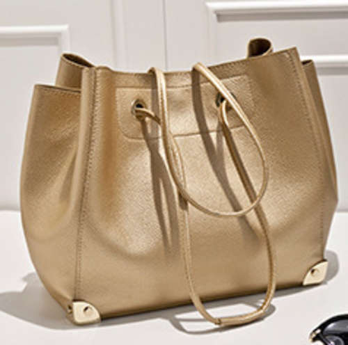 Amazing design ladies large handbag with strap and a inner nubuck bag. Light Gold color. Stock in ZA