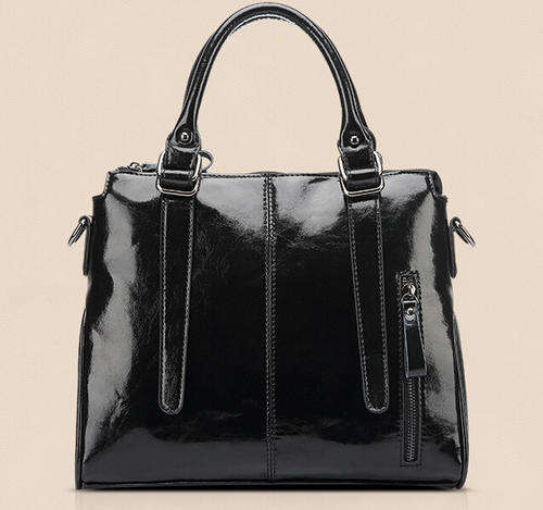 Smooth surface elegant consice ladies handbag with strape. Black color. Stock in ZA