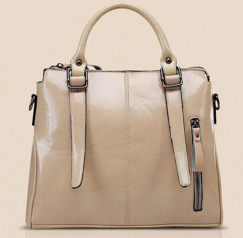 Smooth surface elegant consice ladies handbag with strape. Rice white color. Stock in ZA