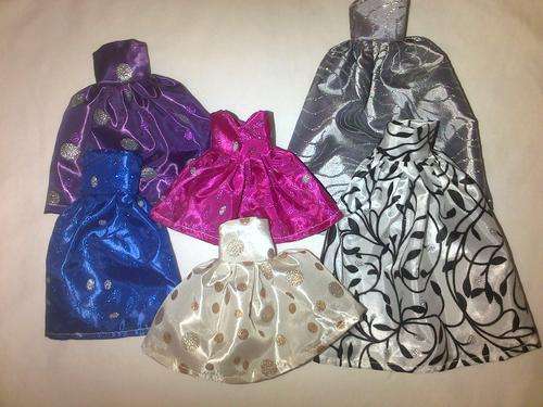 assorted hand made barbie doll clothes