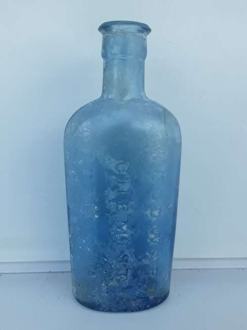 Antique light blue Woodward Chemist bottle