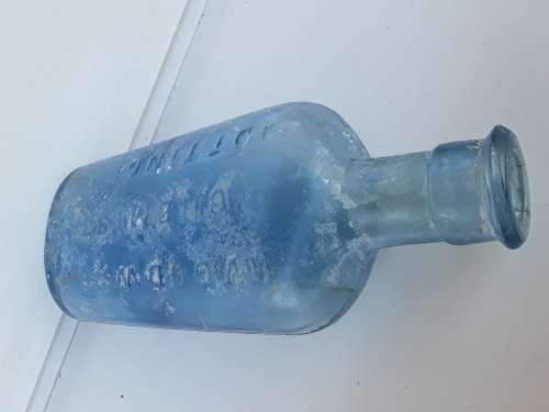 Antique light blue Woodward Chemist bottle