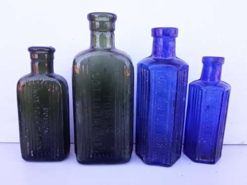 Two blue and two green NOT TO BE TAKEN bottles