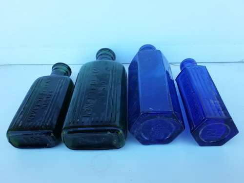 Two blue and two green NOT TO BE TAKEN bottles