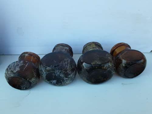 Four Bovril bottles
