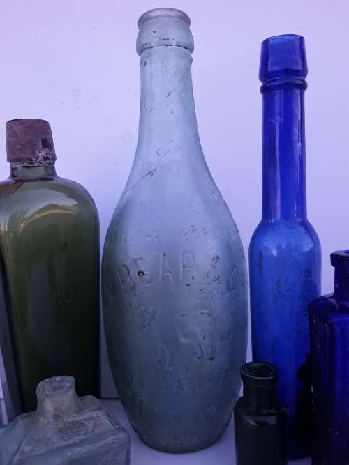 Collection of 9 antique bottles
