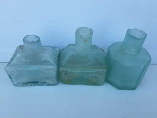 Three ink bottles