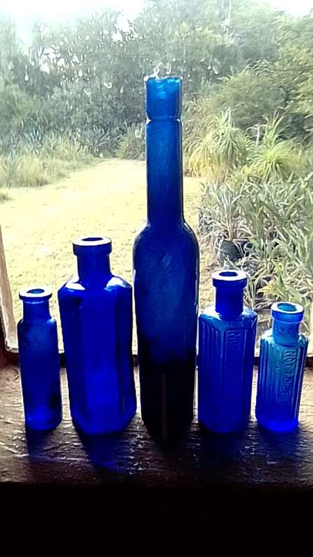 Five antique blue bottltes