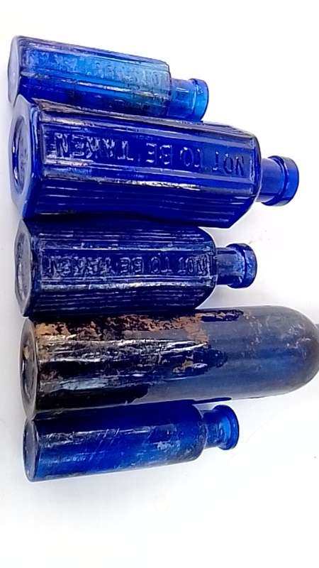 Five antique blue bottltes